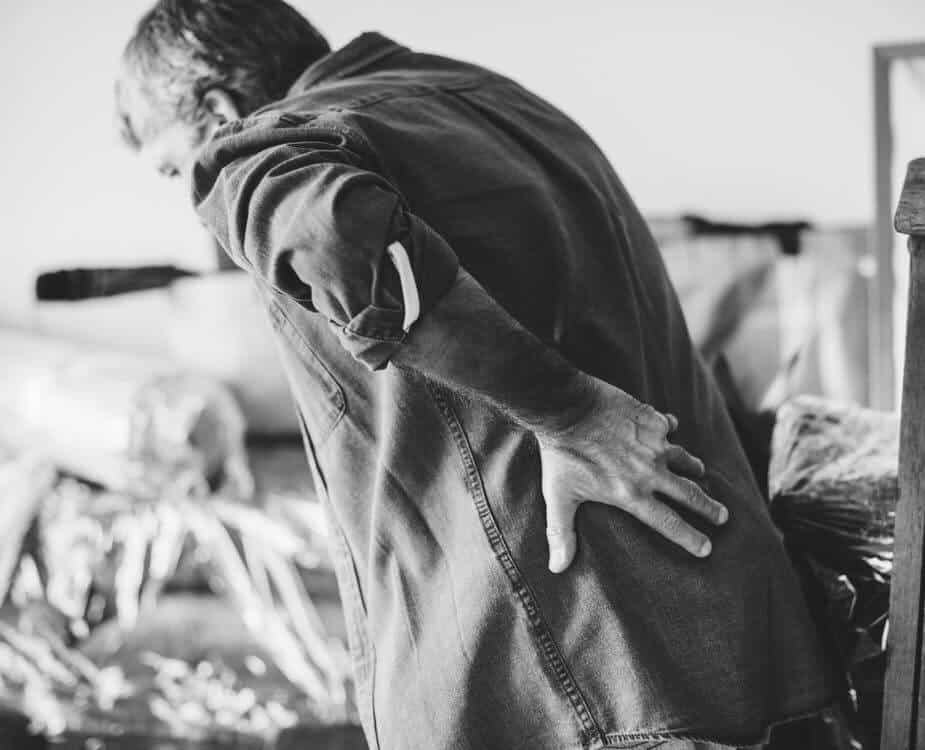 black and white photo of a man with a bad back