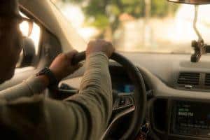 Elderly driver behind the wheel of a car