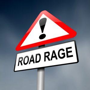 Road sign with an exclamation point and the words "road rage"