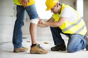 worker helping an injured worker walk