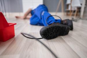 electrician falling after getting his foot caught in wire