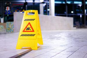 yellow wet floor sign on a restaurant floor