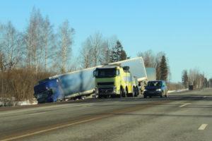 freight truck runs off road after collision