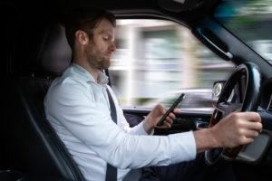 motorist using handheld device while driving