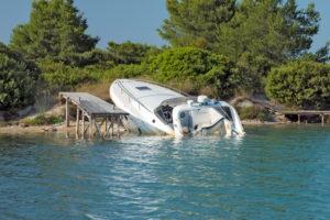 Speedboat crashed into dock or debris, emphasizing the necessity of legal help for boating accident victims.