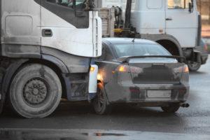 truck collides with the side of a car