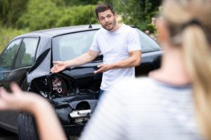 Two drivers argue over damage after a collision