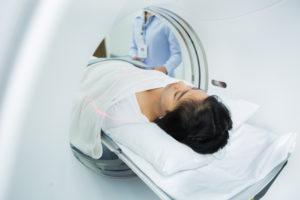 asian woman entering brain ct scan