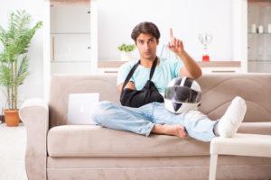 injured motorcycle rider on the couch