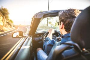 man driving convertible