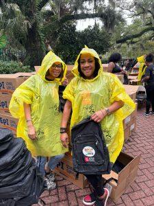 Morris Bart employee volunteers in ponchos